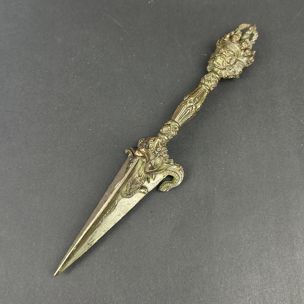 A TIBETAN BRONZE PHURBA.