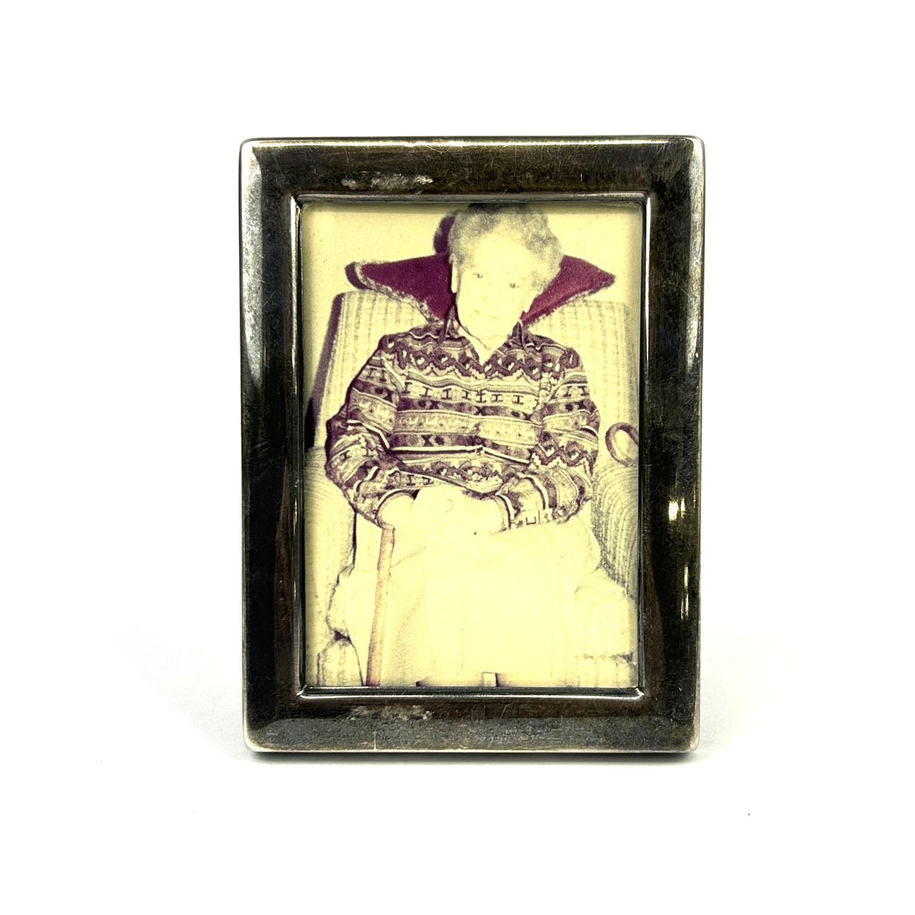 A SMALL HALLMARKED SILVER PHOTO FRAME.