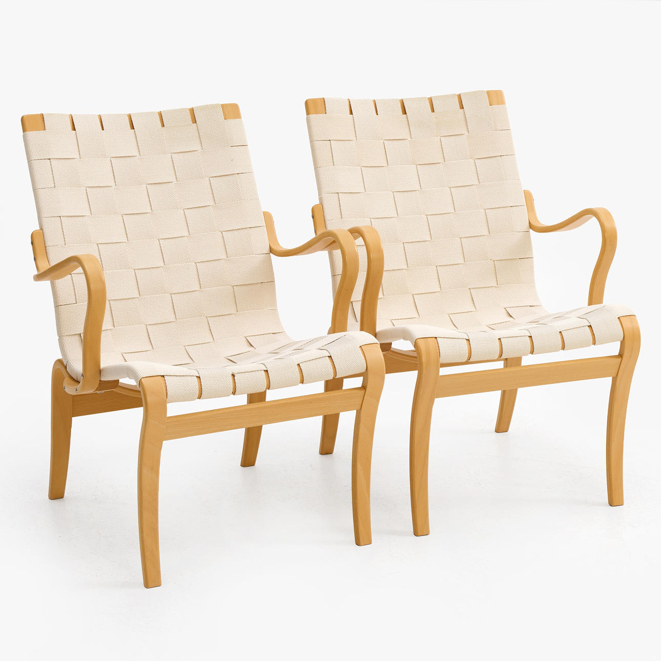 BRUNO MATHSSON. Armchairs, a pair, “Mina”, Bruno Mathsson International, dated 2006, branded, frame in beech, seat in braided saddle soil.