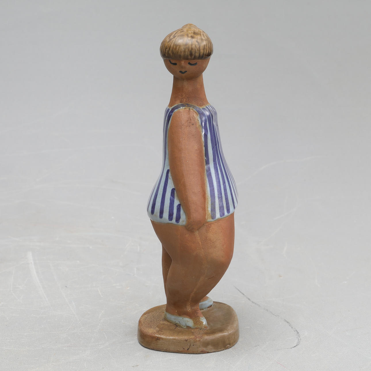 LISA LARSON. A stoneware figurine, 