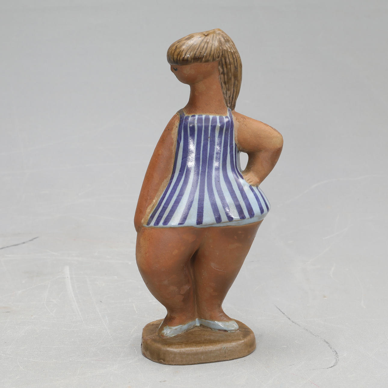 LISA LARSON. A stoneware figurine, 