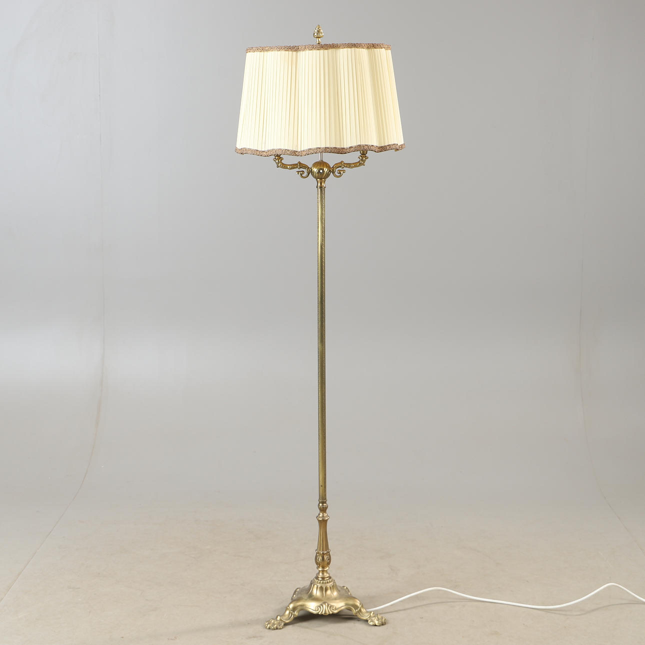 A brass floor lamp, mid 20th century.