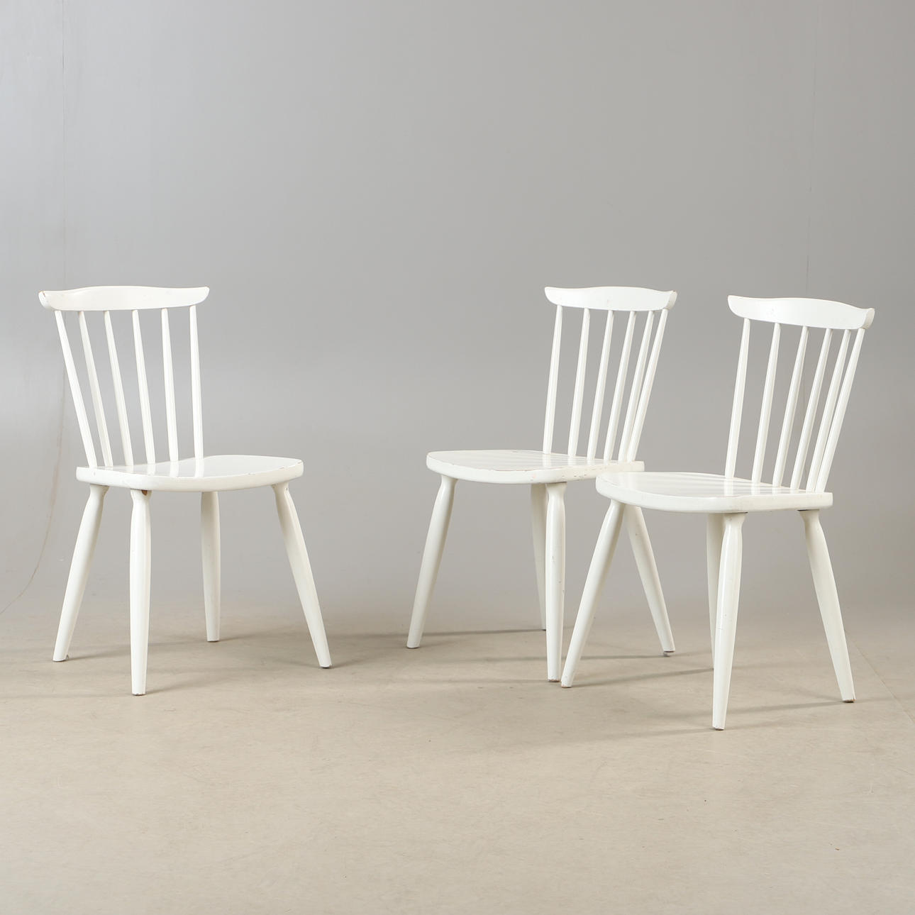 Three mid 20th century chairs.