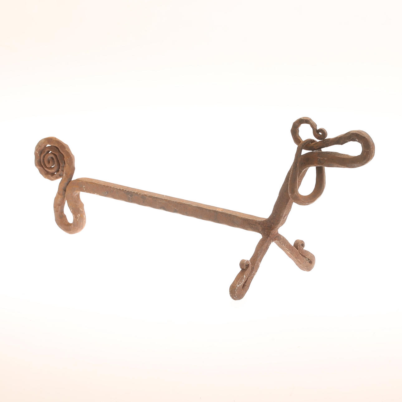 A 20th-century blacksmith's fire dog.