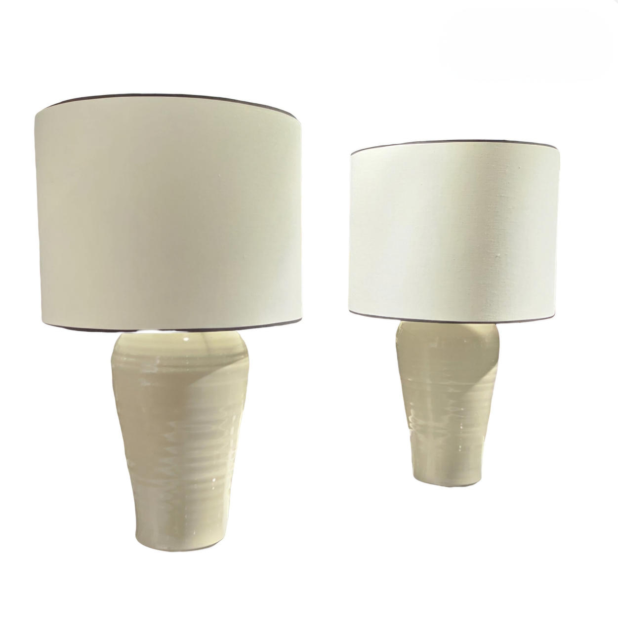 Pair of white glazed ceramic table lamps.