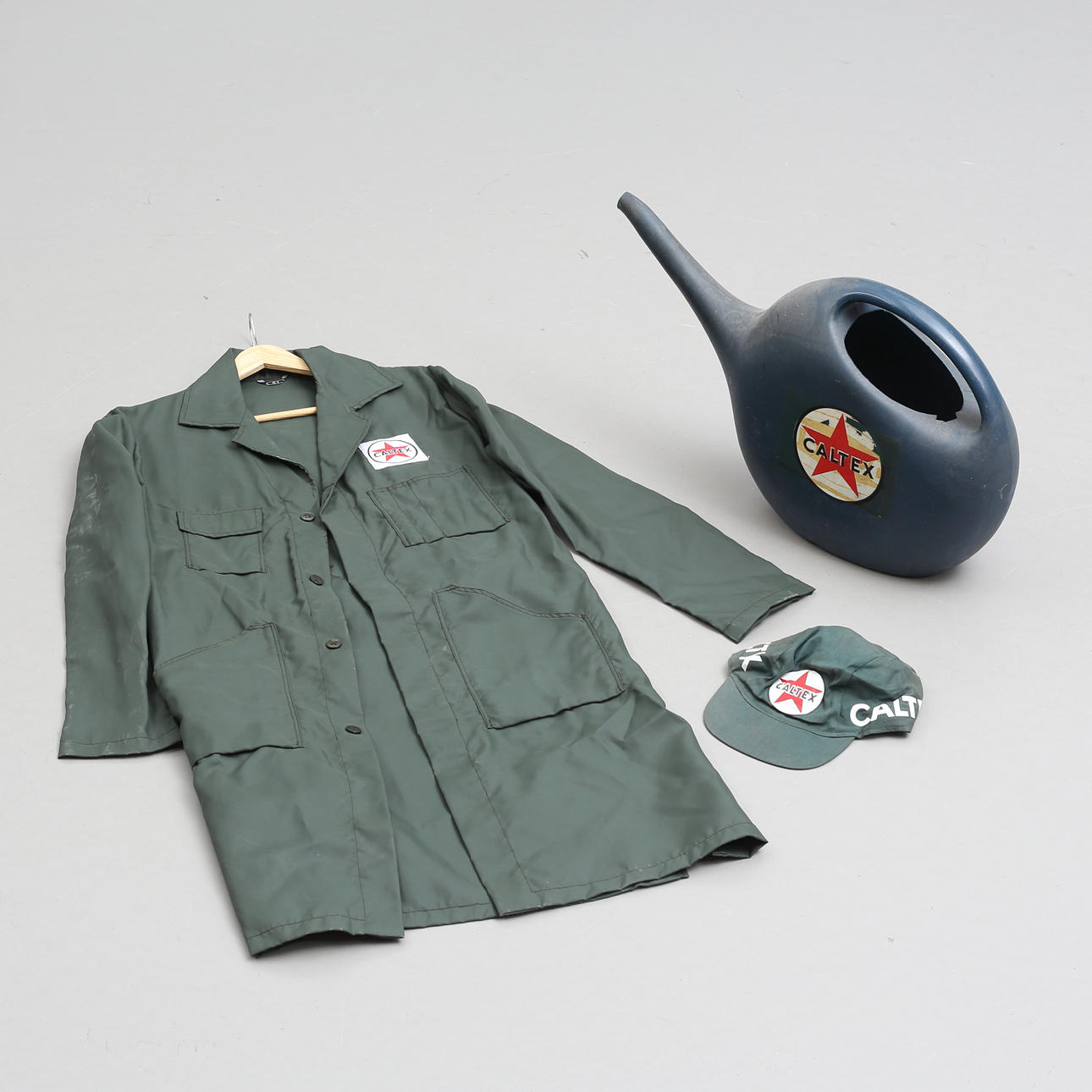 A “CALTEX”, WORK COAT AND CAP, circa mid 20th century.
