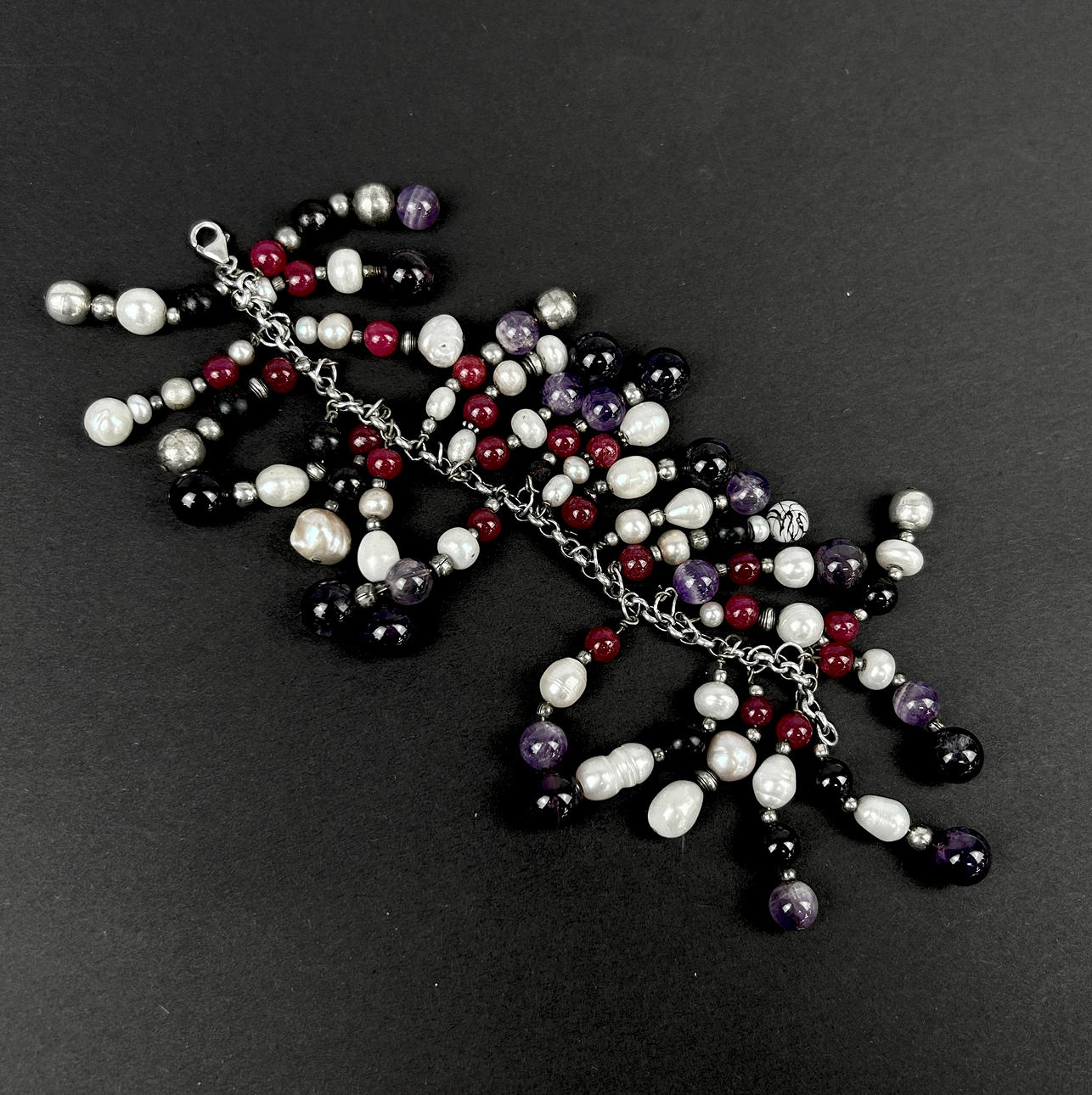 SILVER, PEARL AND STONE SET BRACELET.