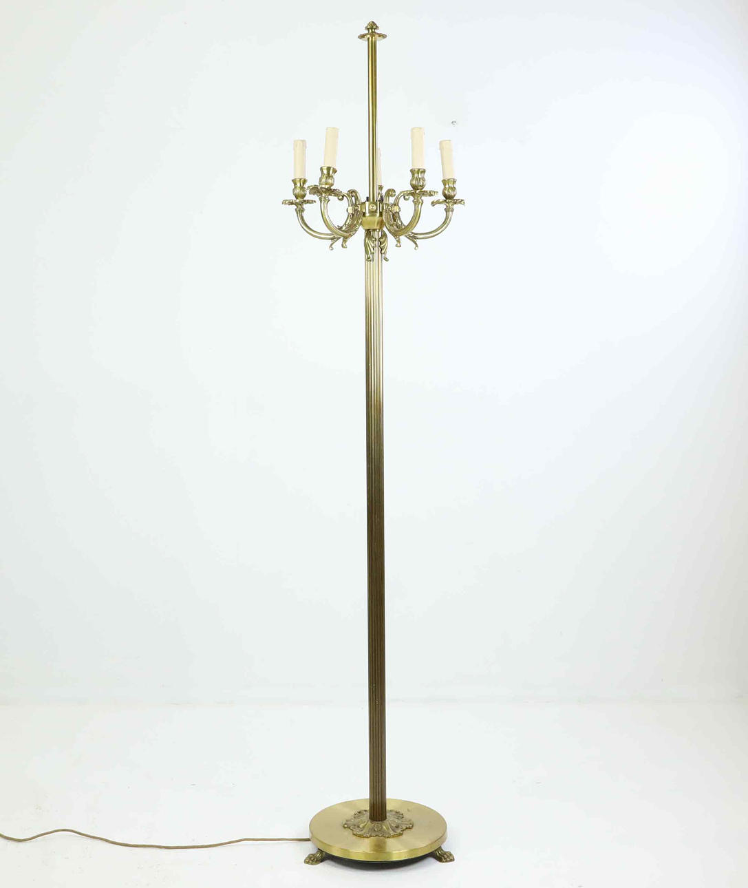 A brass floor lamp, mid 20th century.