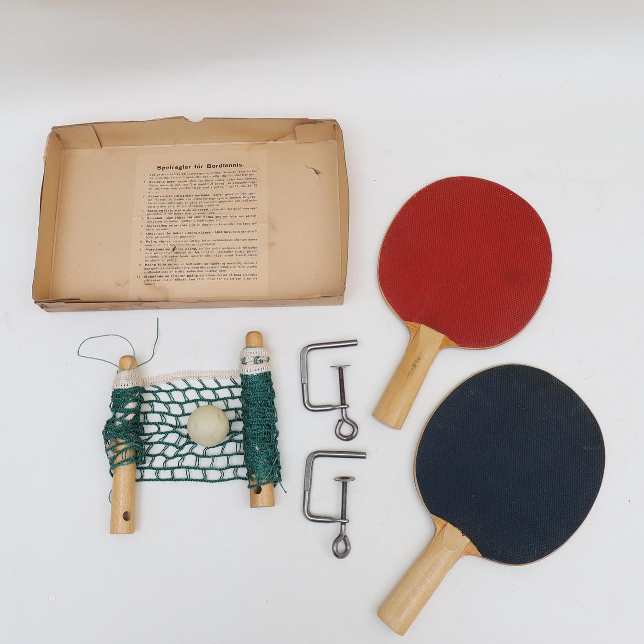 A mid-20th century table tennis set.