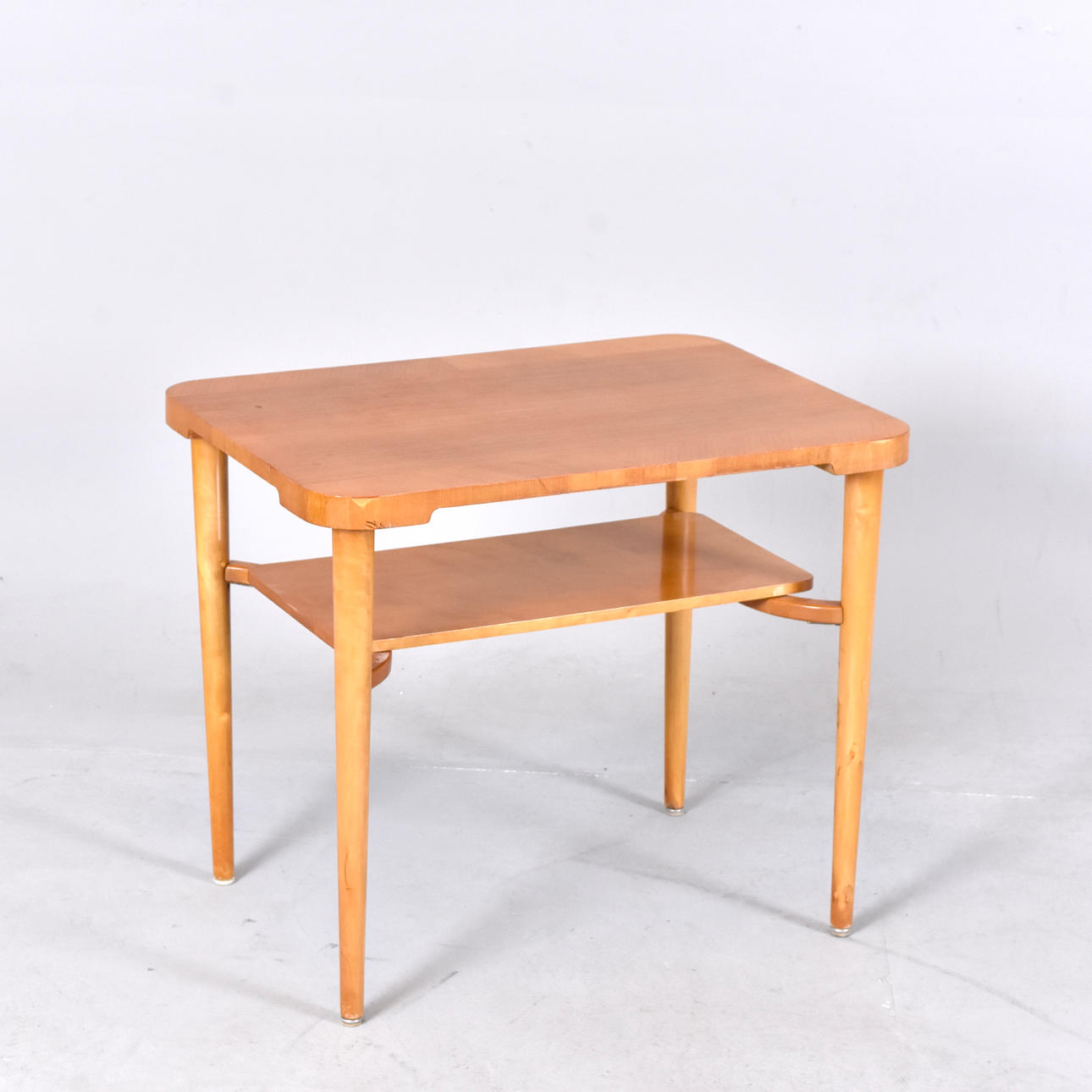 A 20th century birch and elm coffee table.