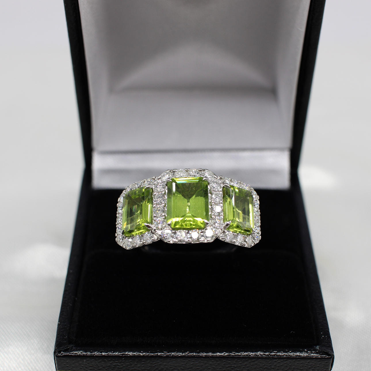 LARGE PERIDOT & DIAMOND TRILOGY RING.