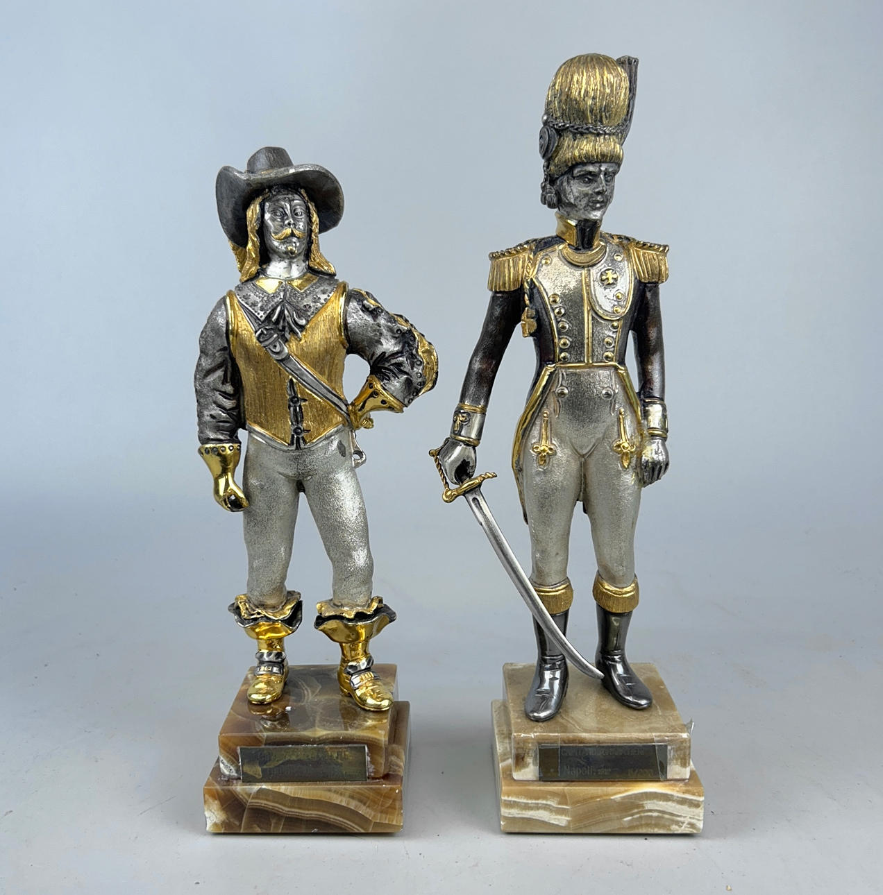 TWO METAL FIGURES ON ONYX BASES.