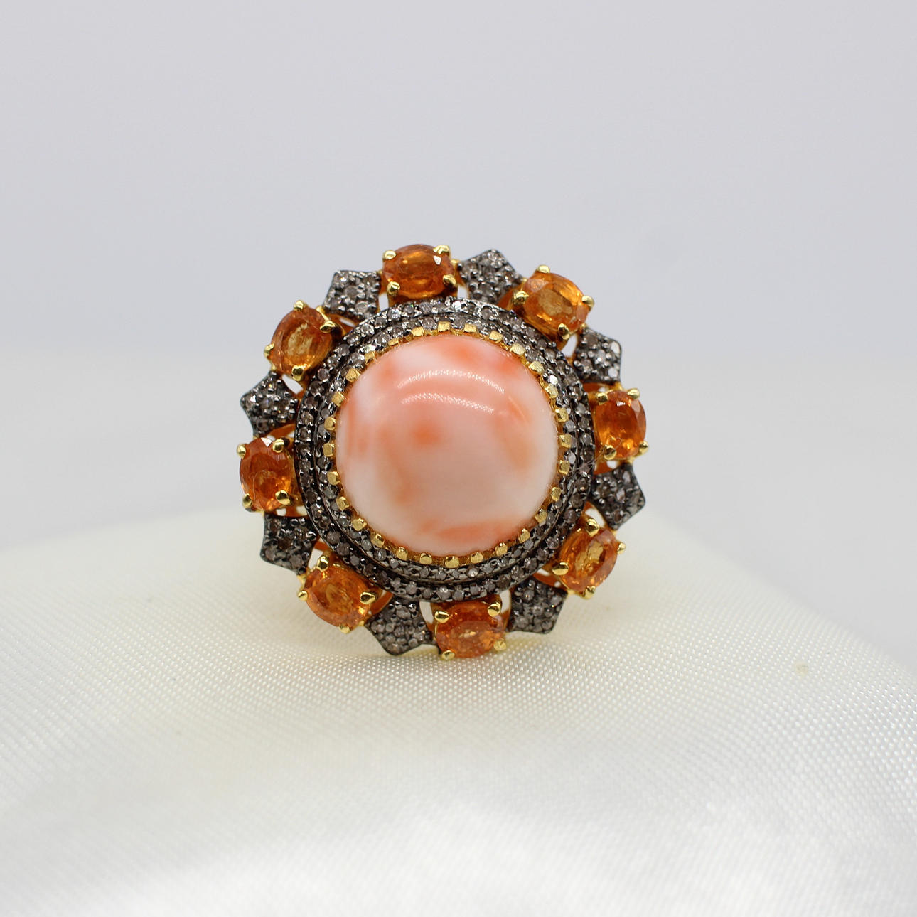 LARGE CORAL, SPESSARTITE & DIAMOND RING.