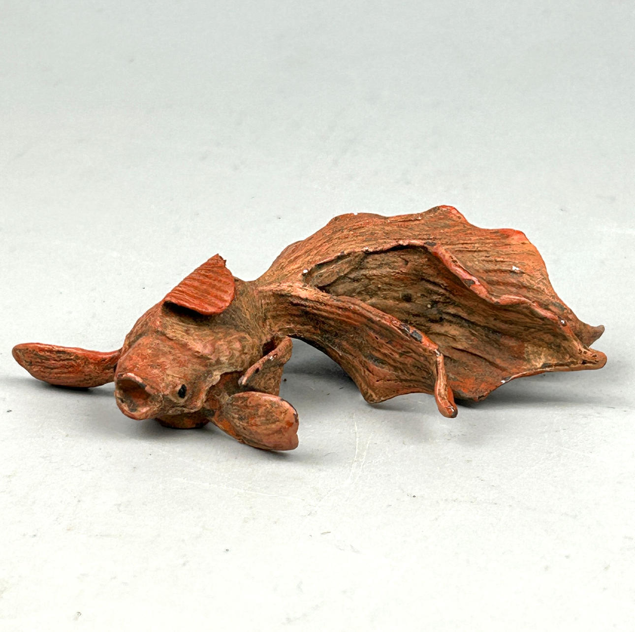 A SMALL COLD PAINTED BRONZE CARP.