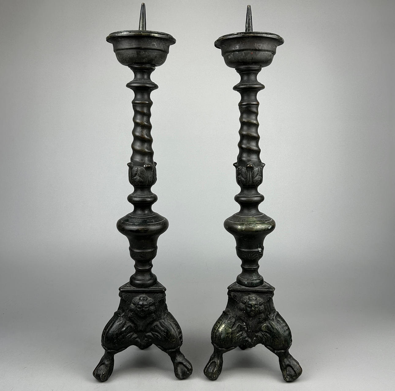 A PAIR OF BRONZE PRICKET CANDLESTICKS.