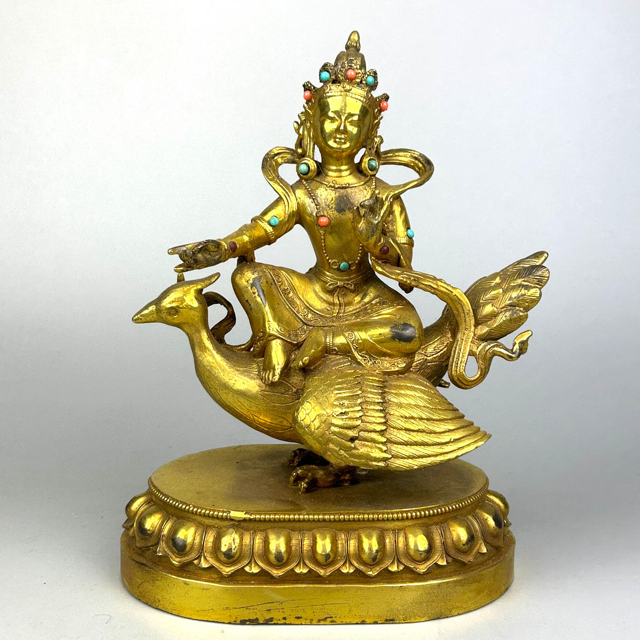TIBETAN GILT BRONZE DEITY.
