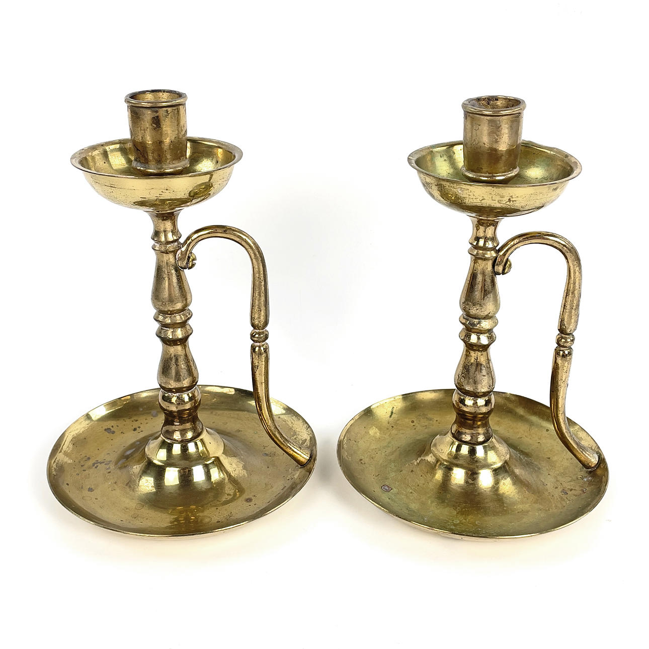 A pair of brass candlesticks, 20th century.
