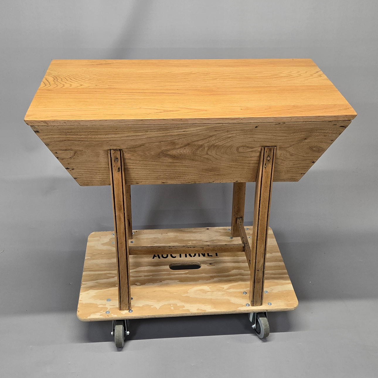 A BLONDE OAK DOUGH BIN.