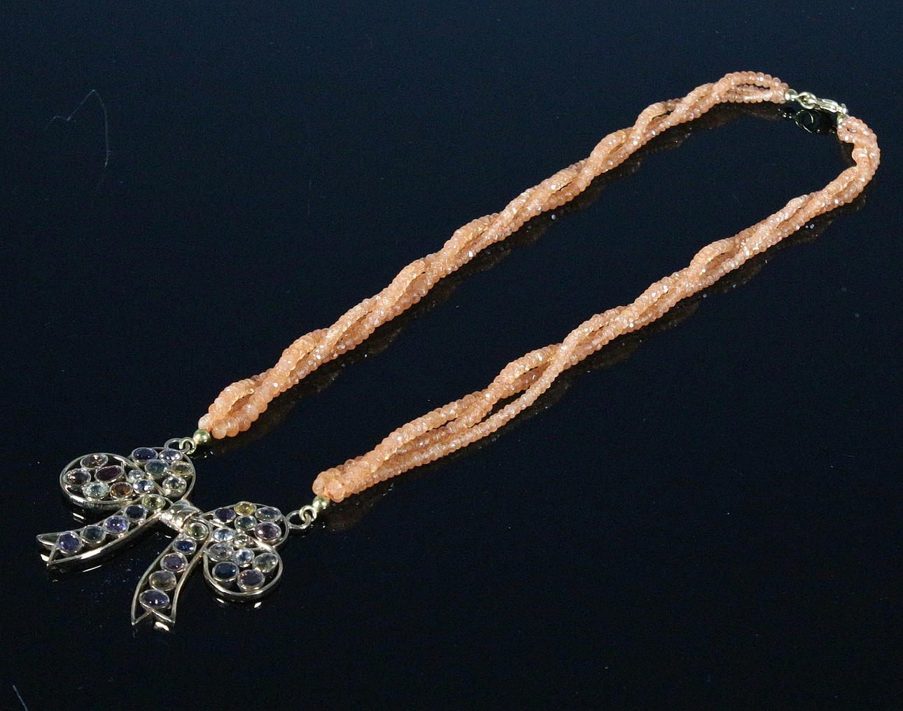 3-row carnelian necklace with bow pendant.