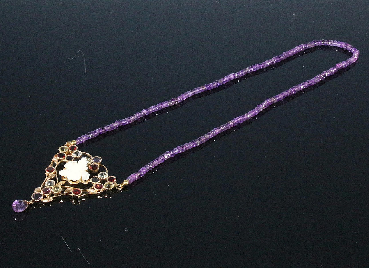 Necklace with amethysts and opal flower.