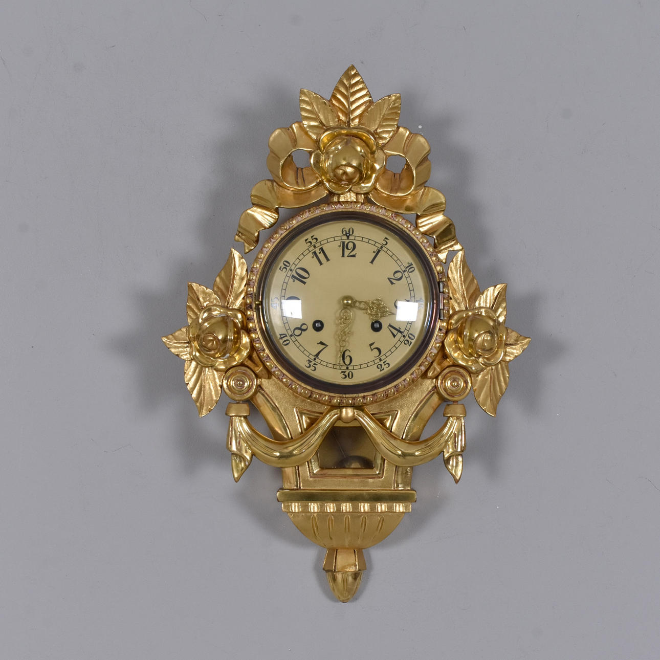 WALL CLOCK, gilded wood and stucco.