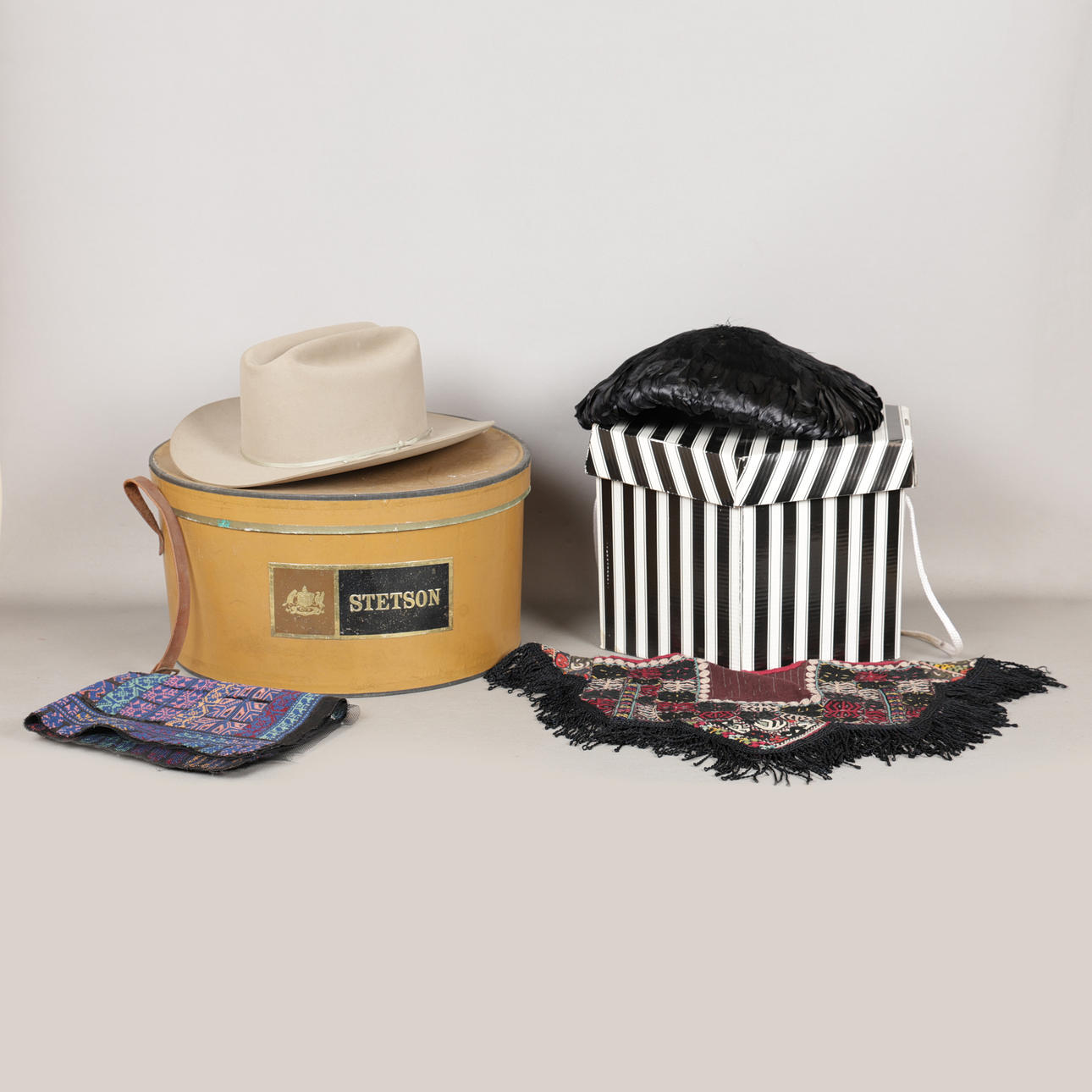 A STETSON HAT, A OSPREY FEATHER HAT AND TWO TEXTILES (4).