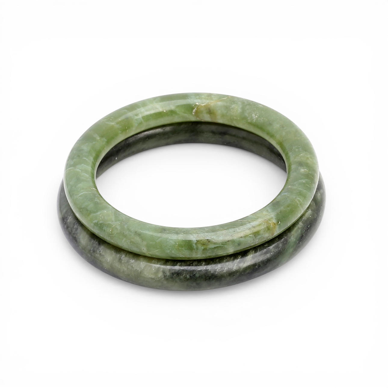 Two Chinese bangle bracelets in jade.