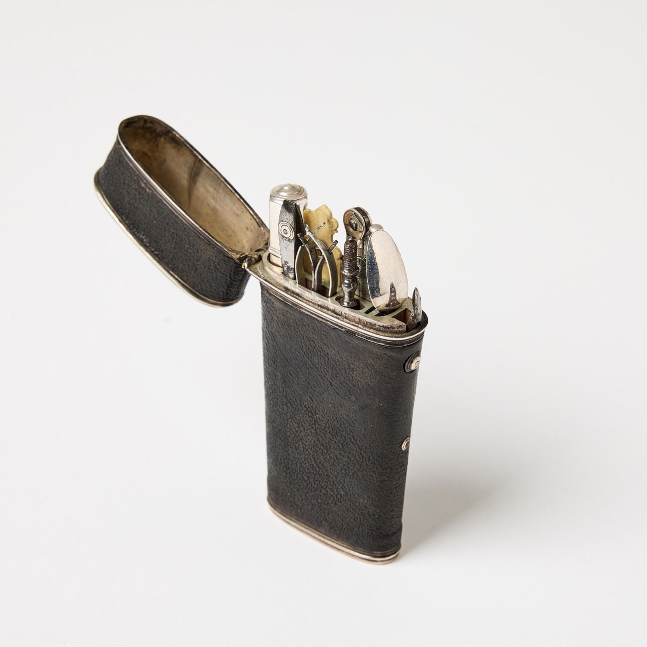 CASE, leather-covered, with utensils, circa 1800.