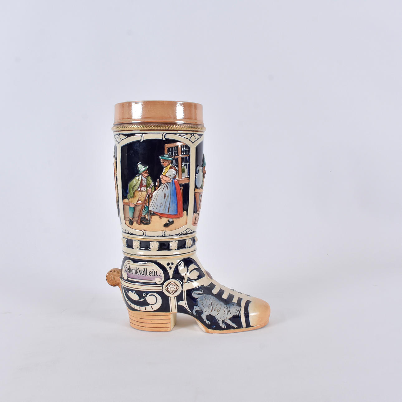 A ceramic beer mug, boot shaped, Werner Cornelius.