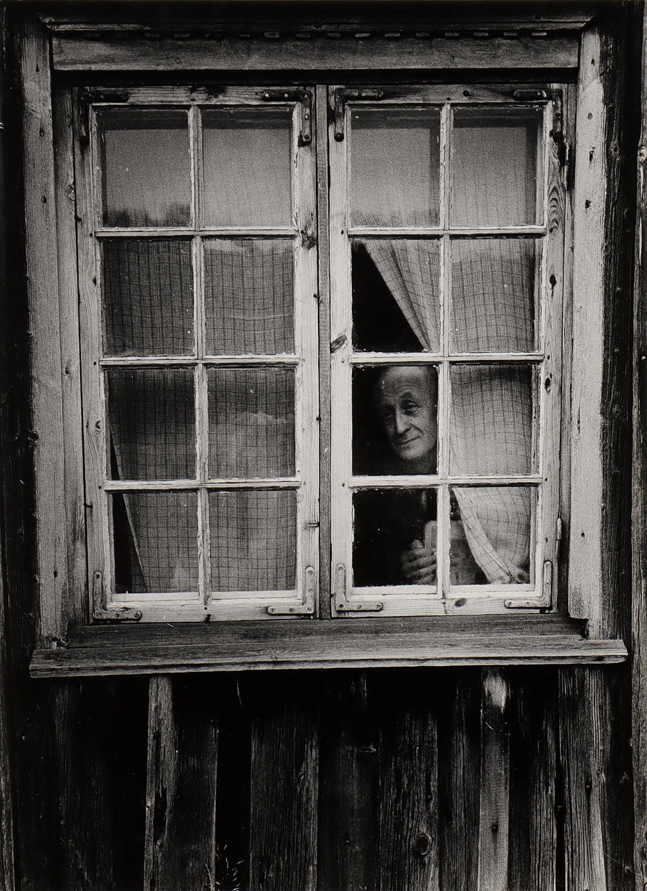 NILS-ERIK WIKEBÄCK. Man in window.