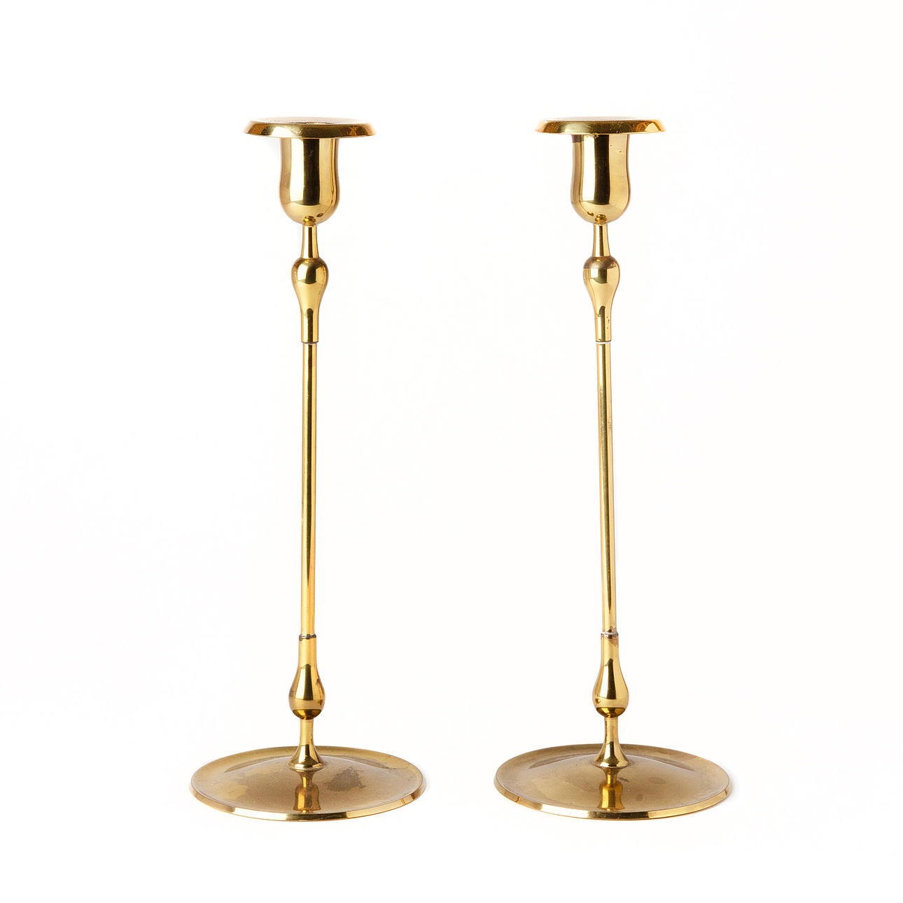 GUNNAR ANDER. Candlesticks, a pair, brass, Ystad Metall.