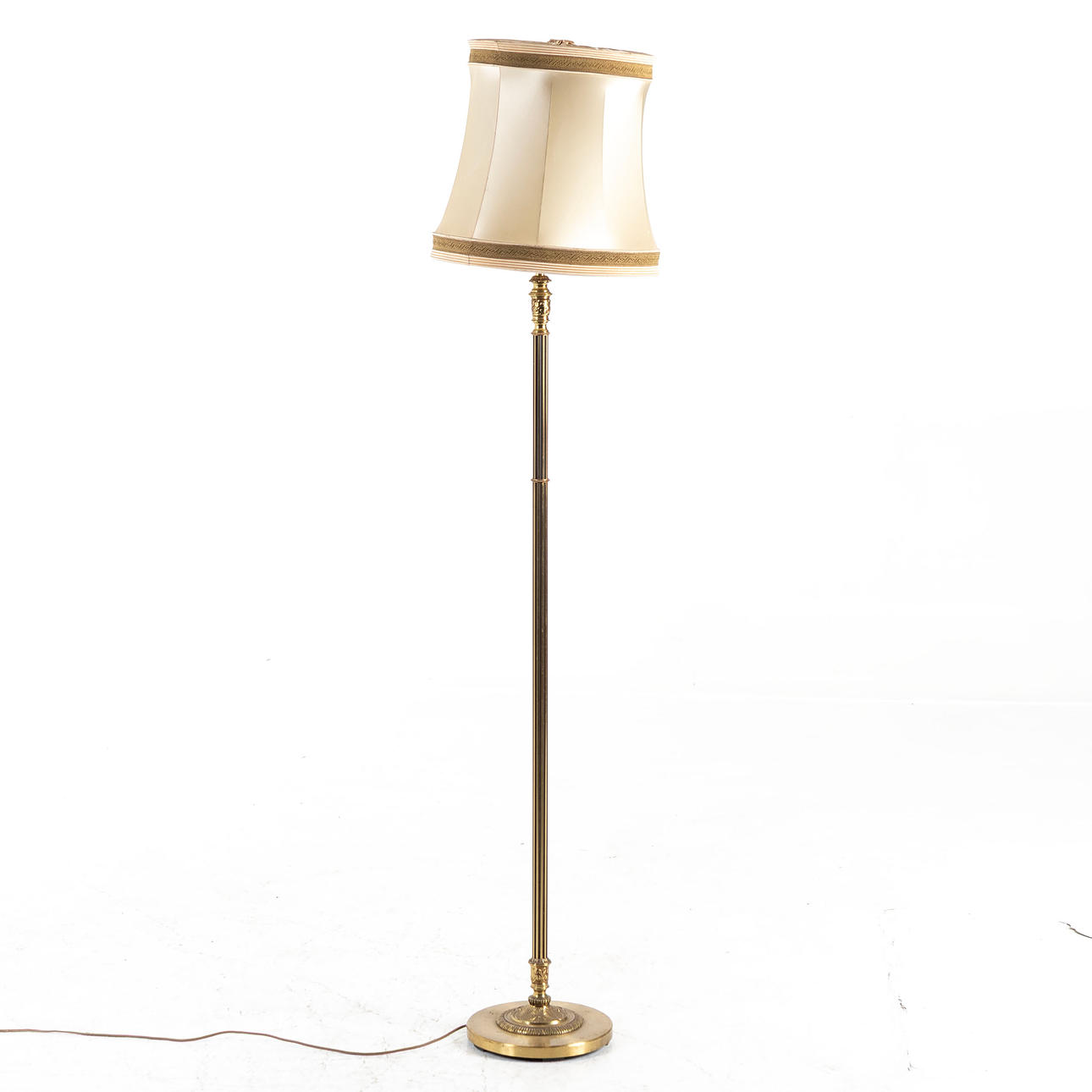 A brass floor lamp, mid 20th century.
