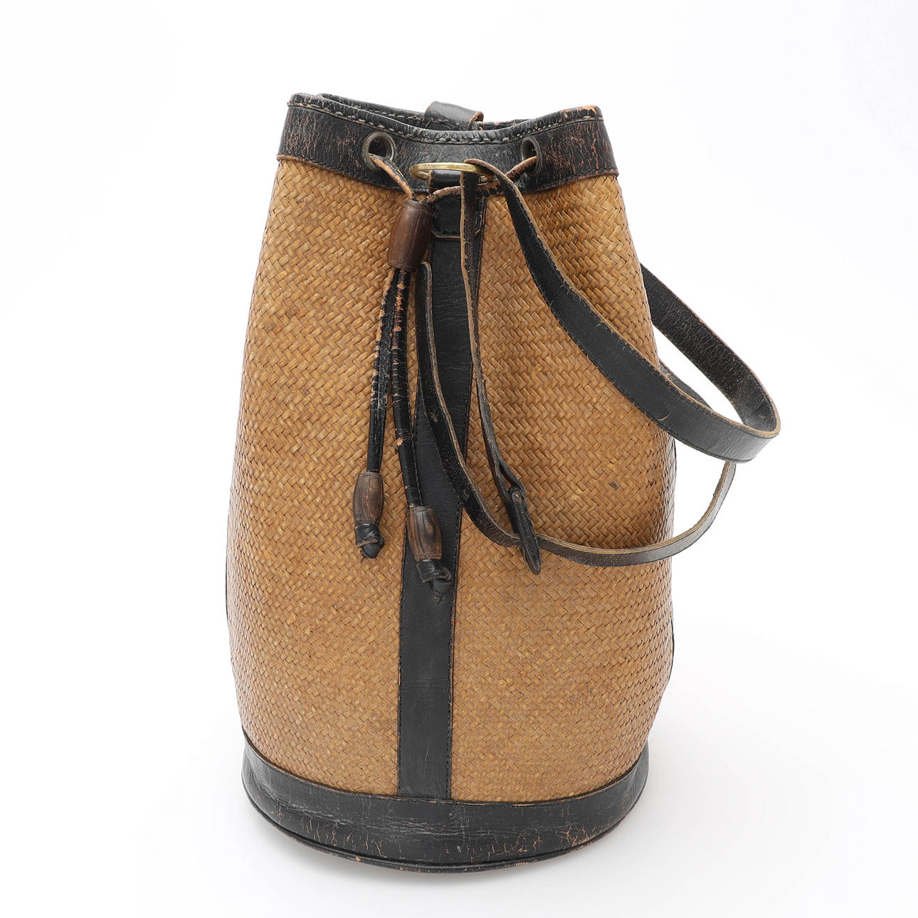 A leather satch/backpack, rattan, 20th century.