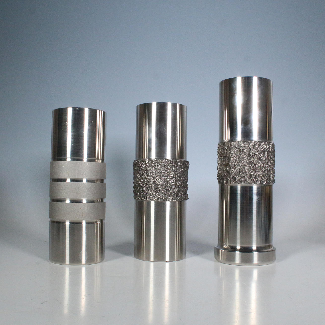 3 Brutalist vases, stainless steel.