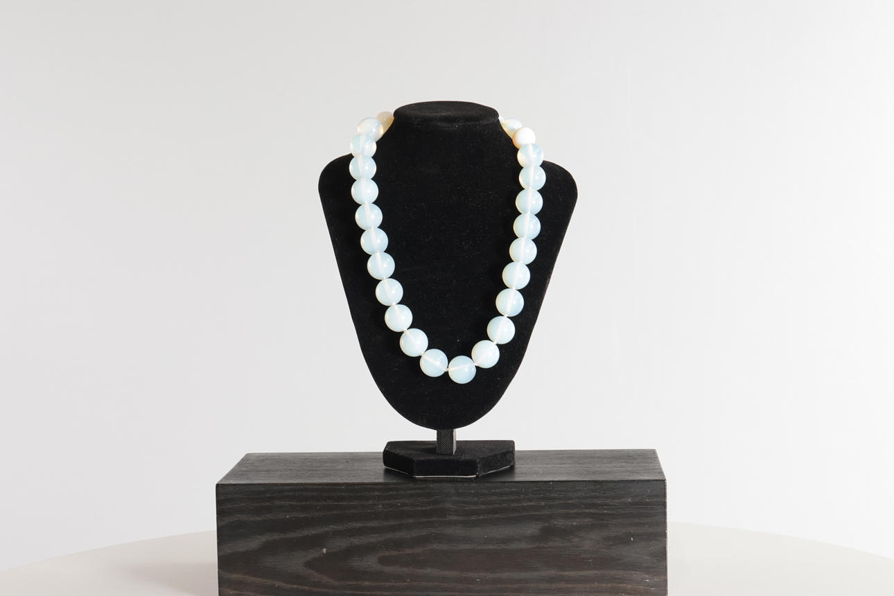 Necklace with beads of Opalit, spherical.