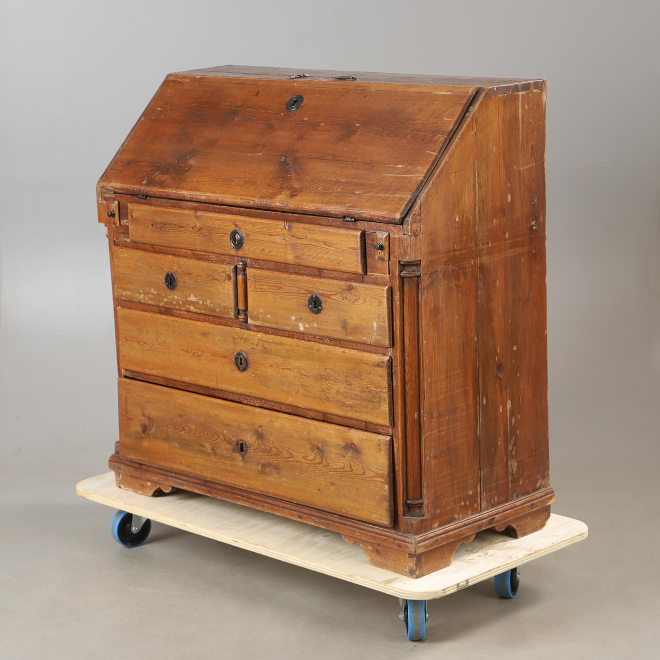 A 19th century pine secretary.