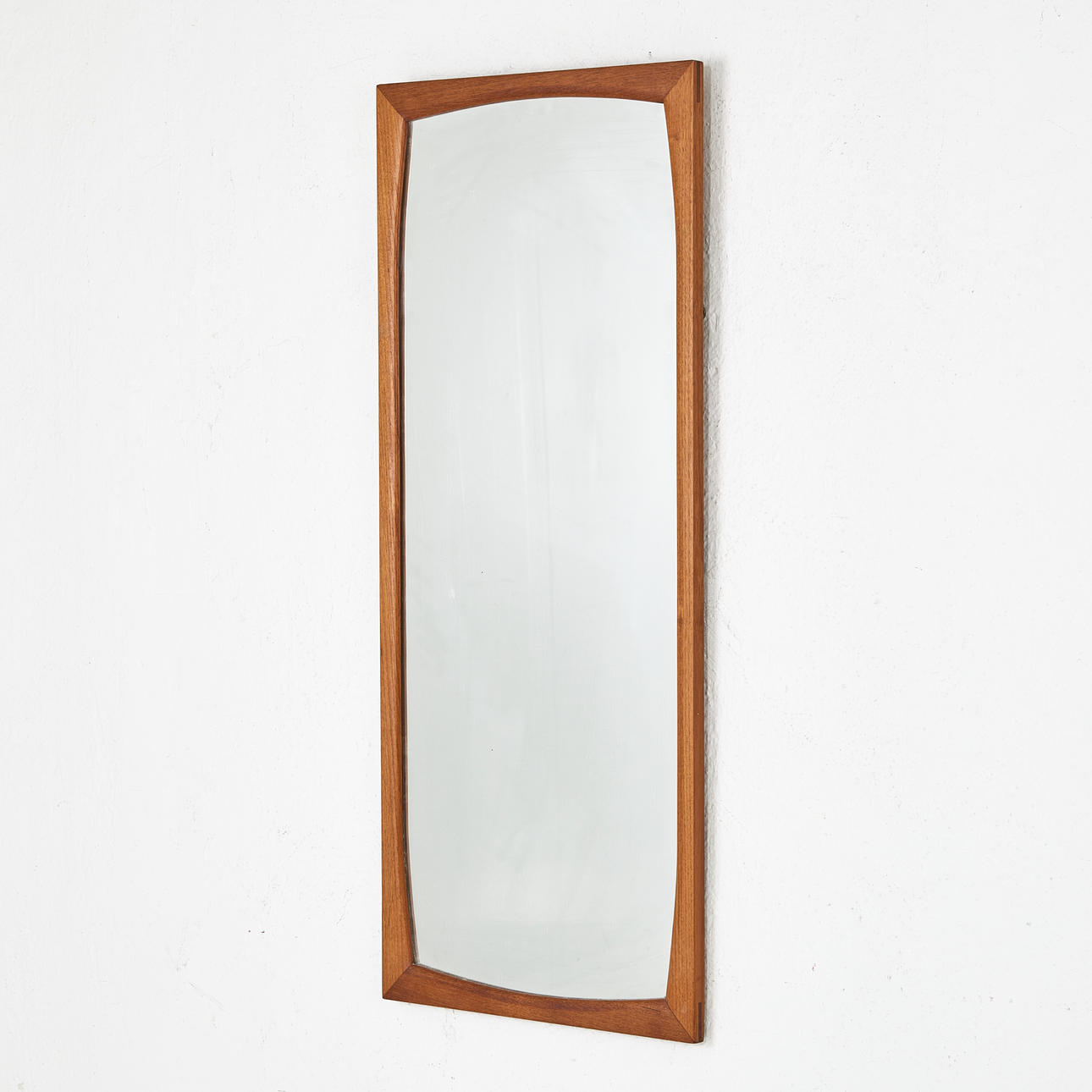 A 1960's teak mirror.