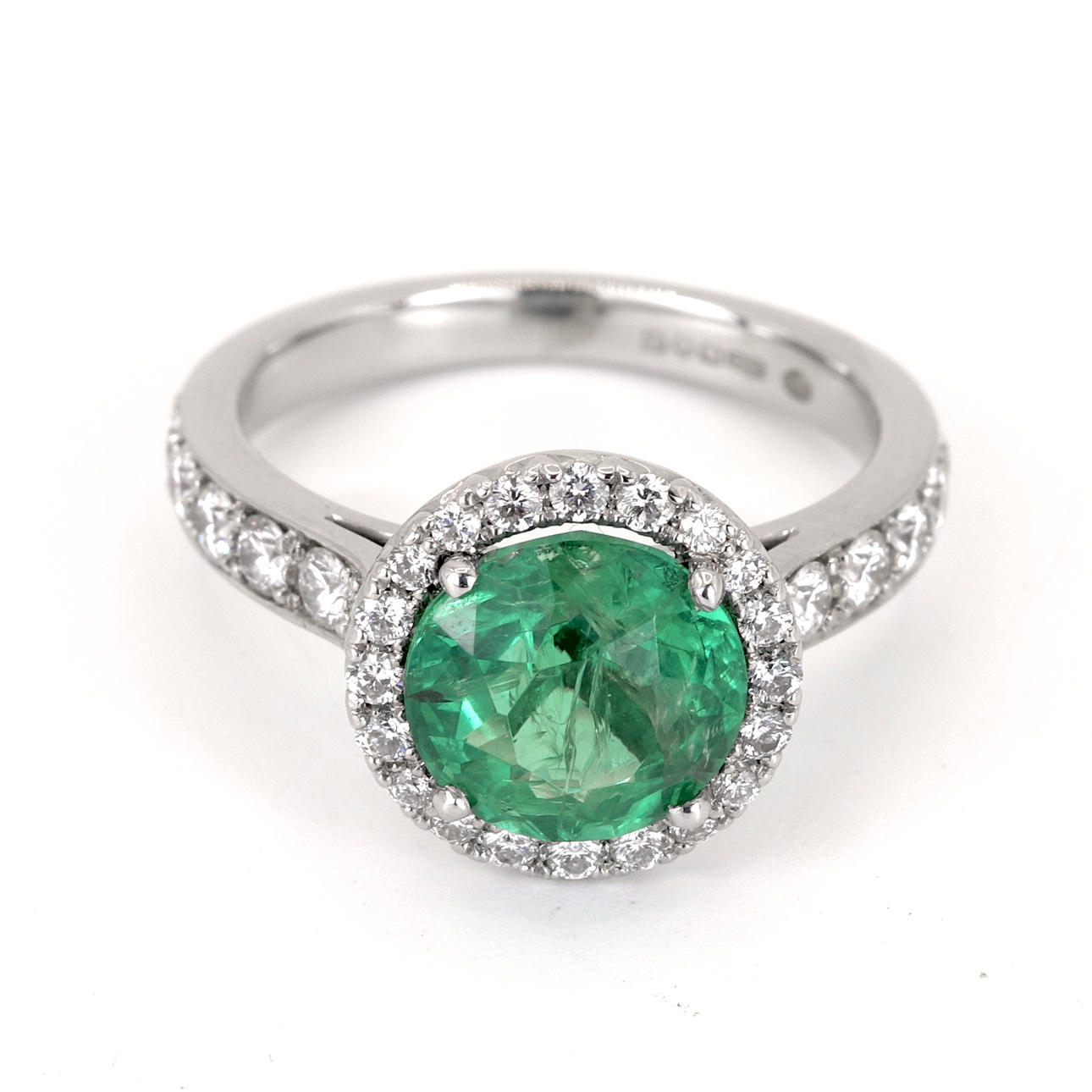 PLATINUM EMERALD & DIAMOND SET RING.