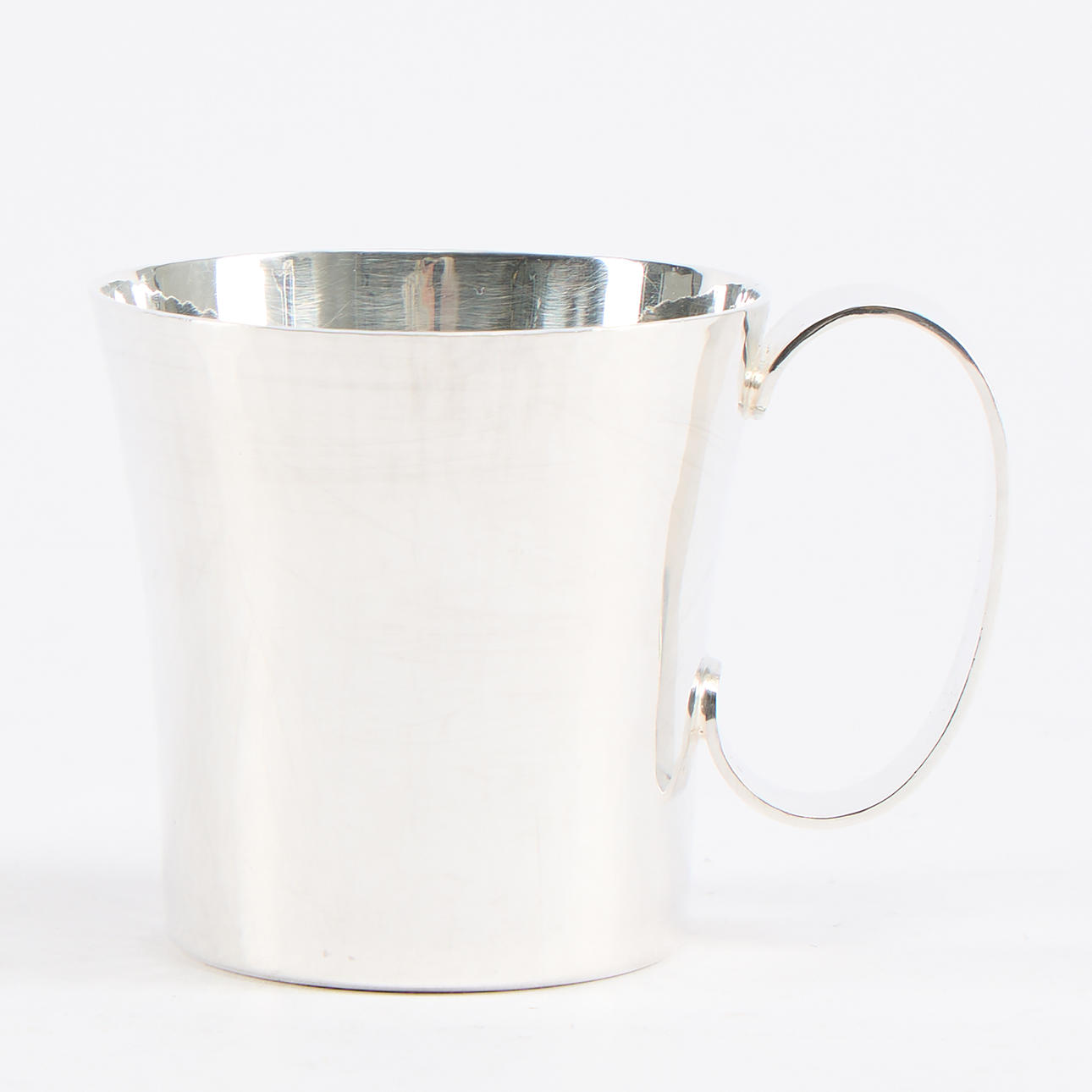 ERIC LÖFMAN (1995-1994). Mugg. Silver Uppsala 1974.