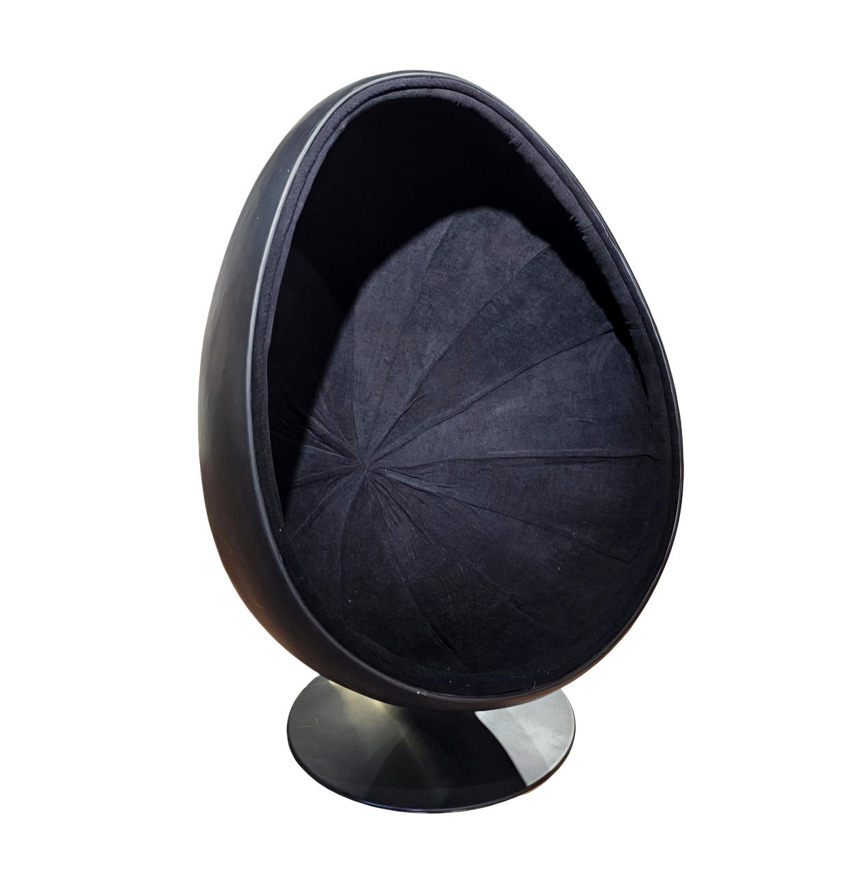 Black “egg” swivel armchair.