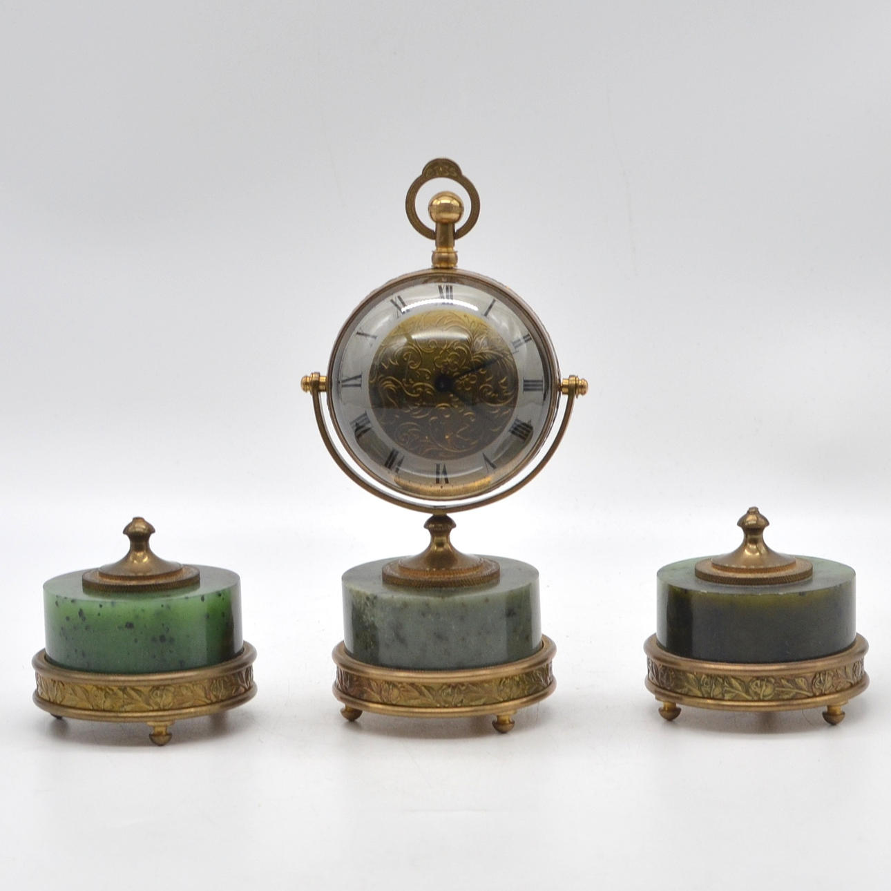 TABLE SET WITH BALL CLOCK, GLASS/ BRASS/ NEPHRITE, ENGRAVED DIAL, CIRCUMFERENTIAL ROSE DECORATION, 20TH CENTURY.