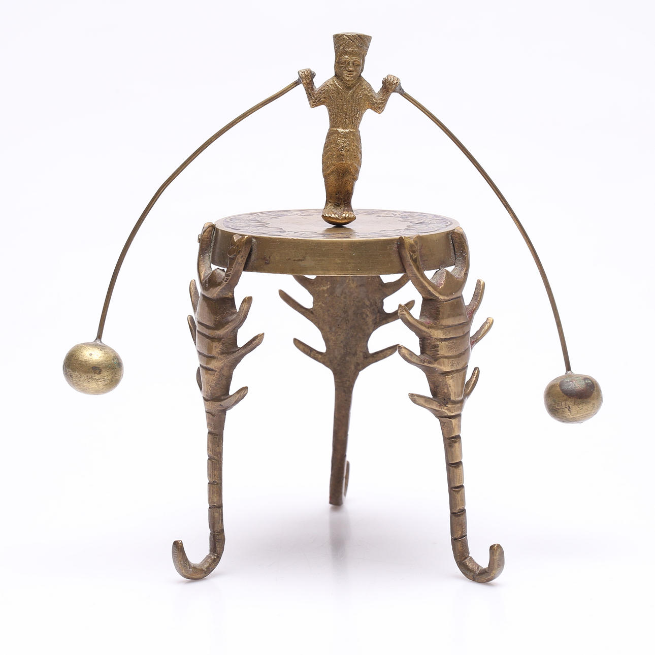 A brass balance toy, probably India.