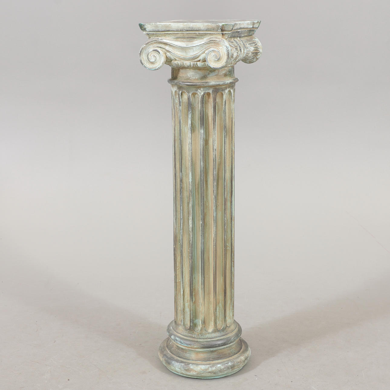 A 20th century plaster column pedestal.