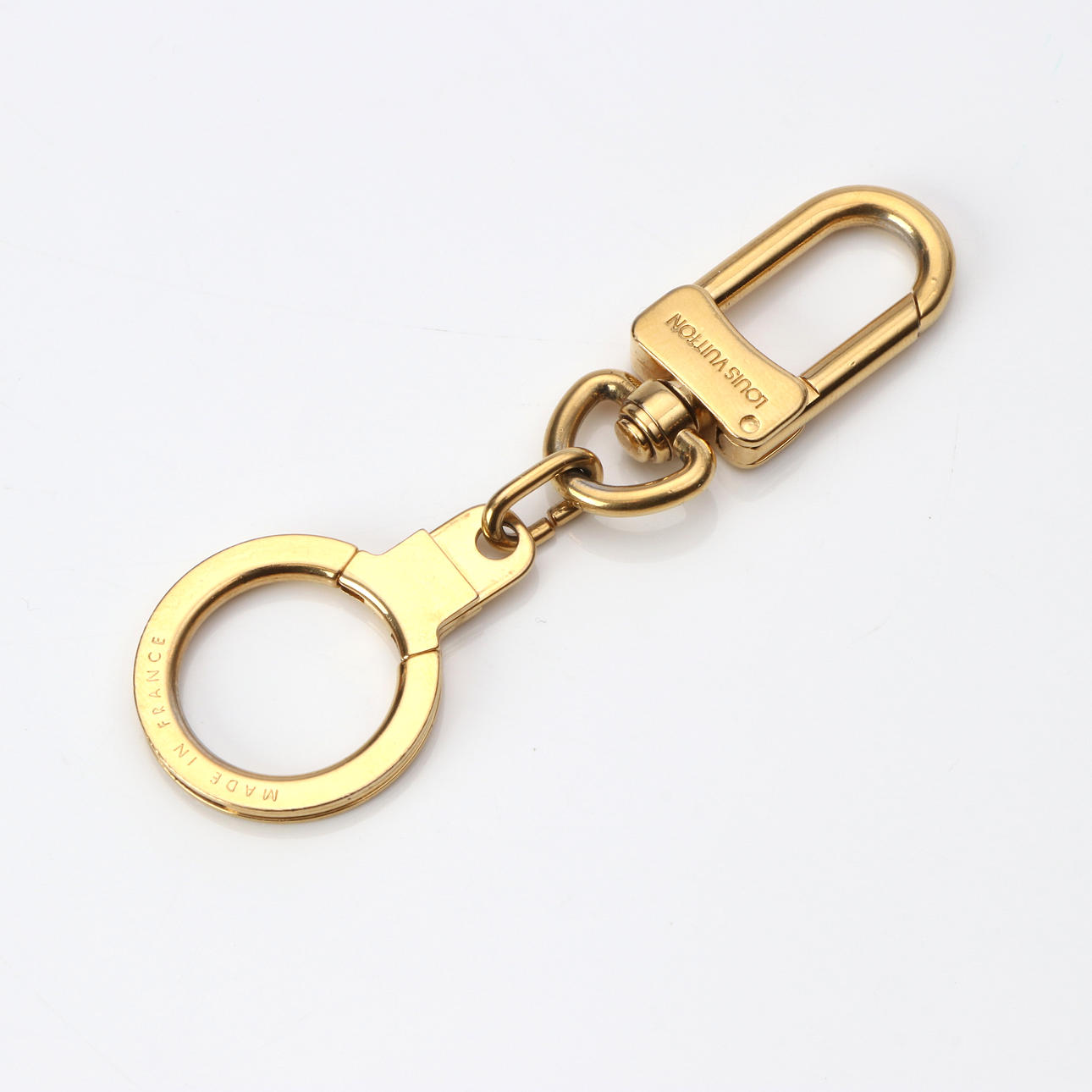 LOUIS VUITTON, NYCKELRING. Guldfärgad metall.