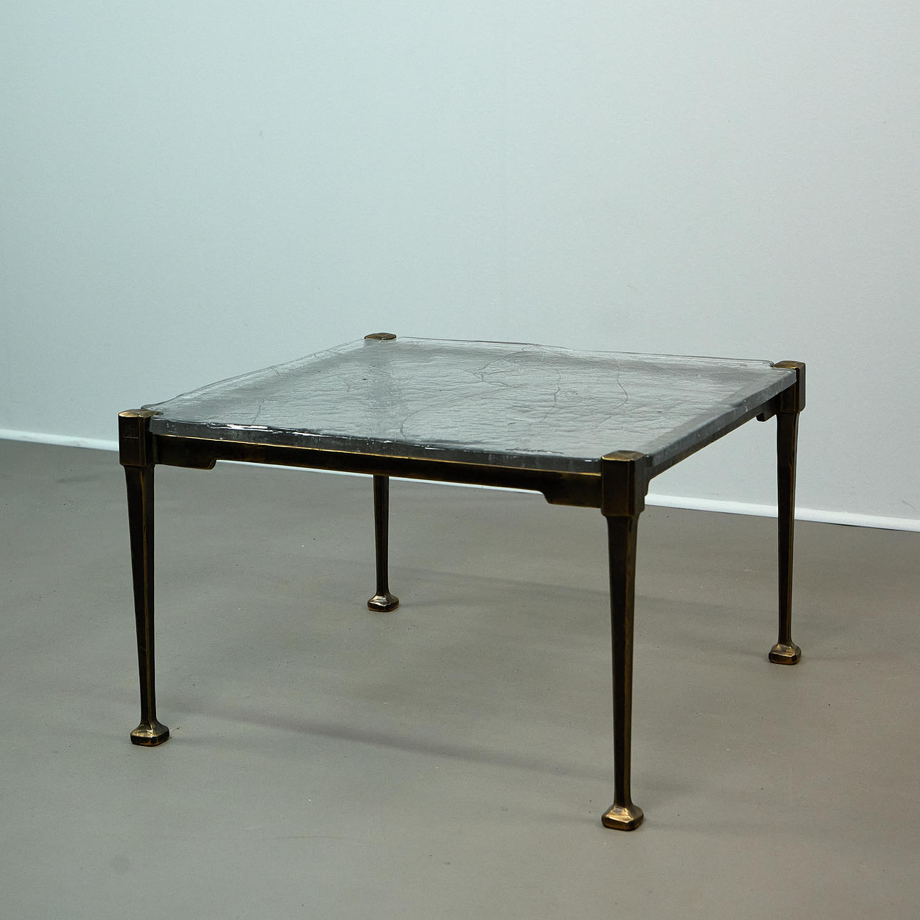 LOTHAR KLUTE. Coffee table/side table, bronze, glass, signed 2007, Germany.