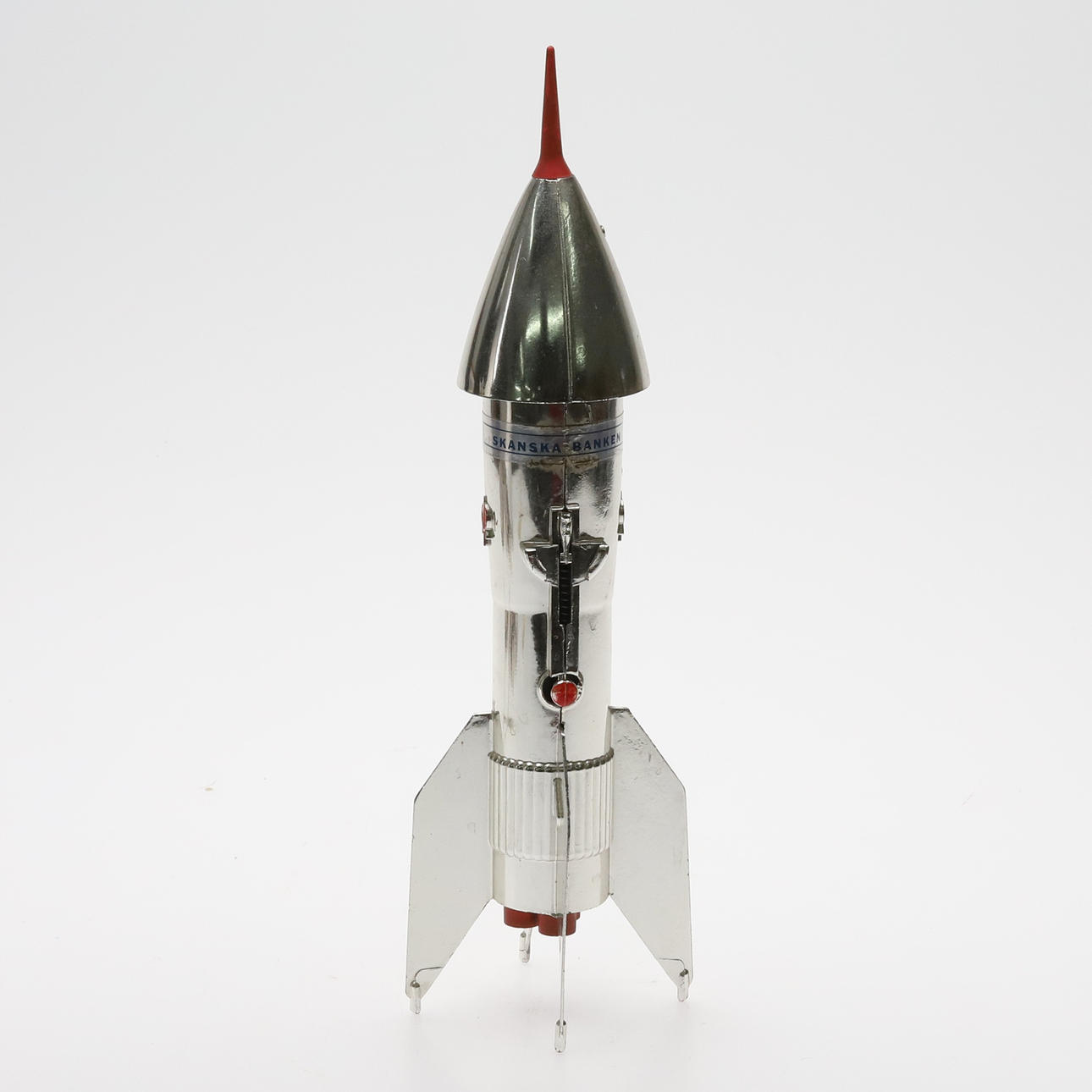A MECHANICAL ROCKET MONEY BOX, USA 1957.