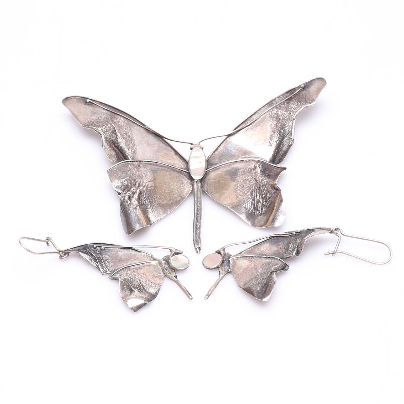 A 3-piece garnish, probably silver.