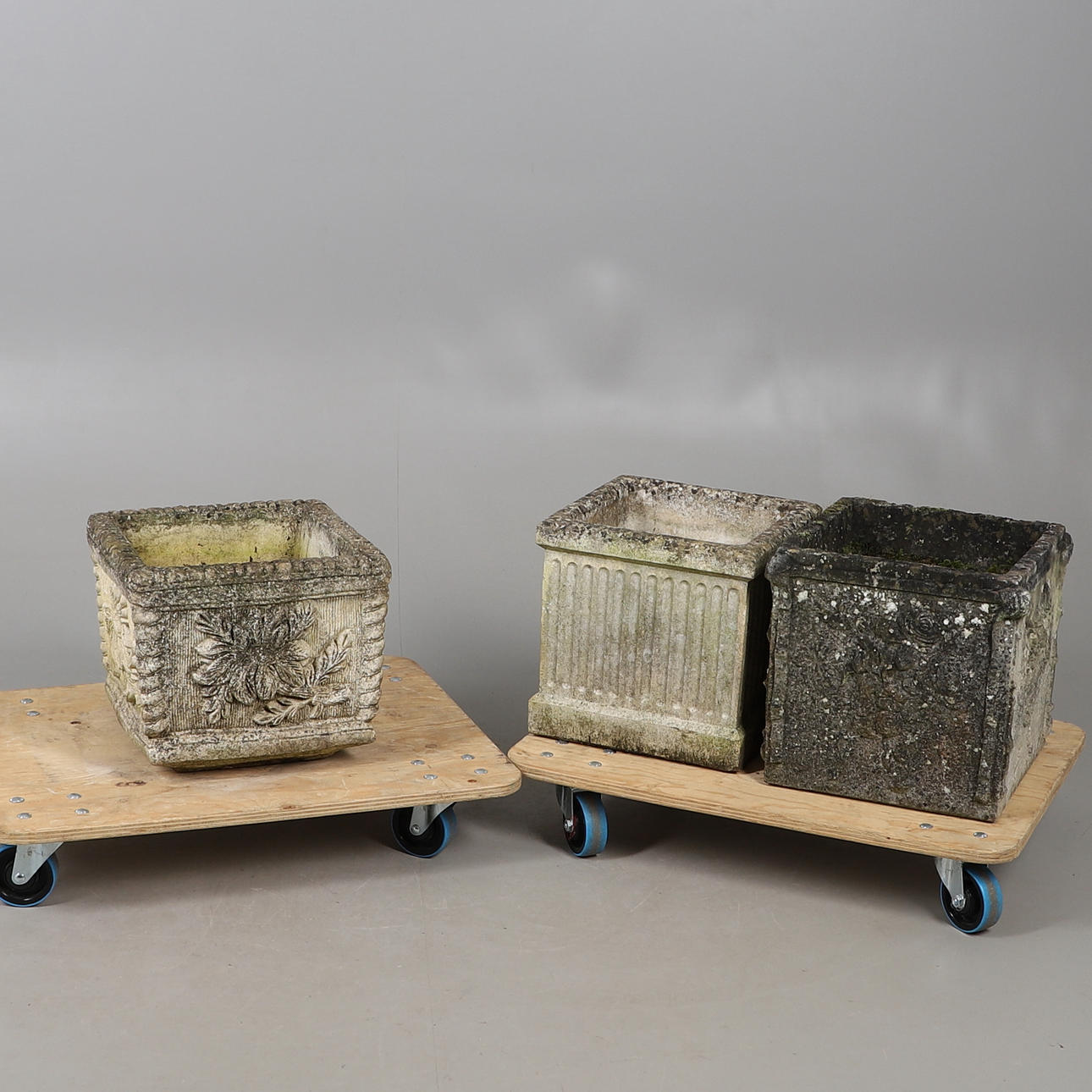 THREE RECONSTITUTED STONE SQUARE GARDEN PLANTERS.