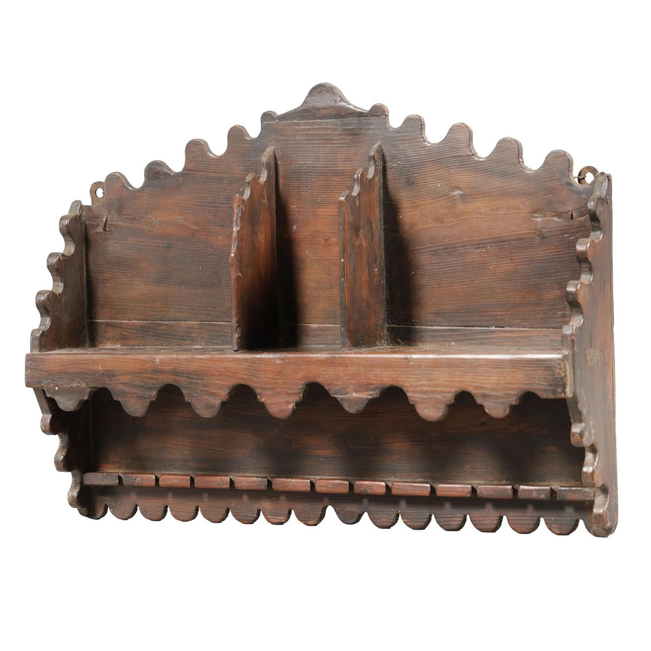 A 19TH CENTURY STAINED PINE HANGING SPOON RACK.
