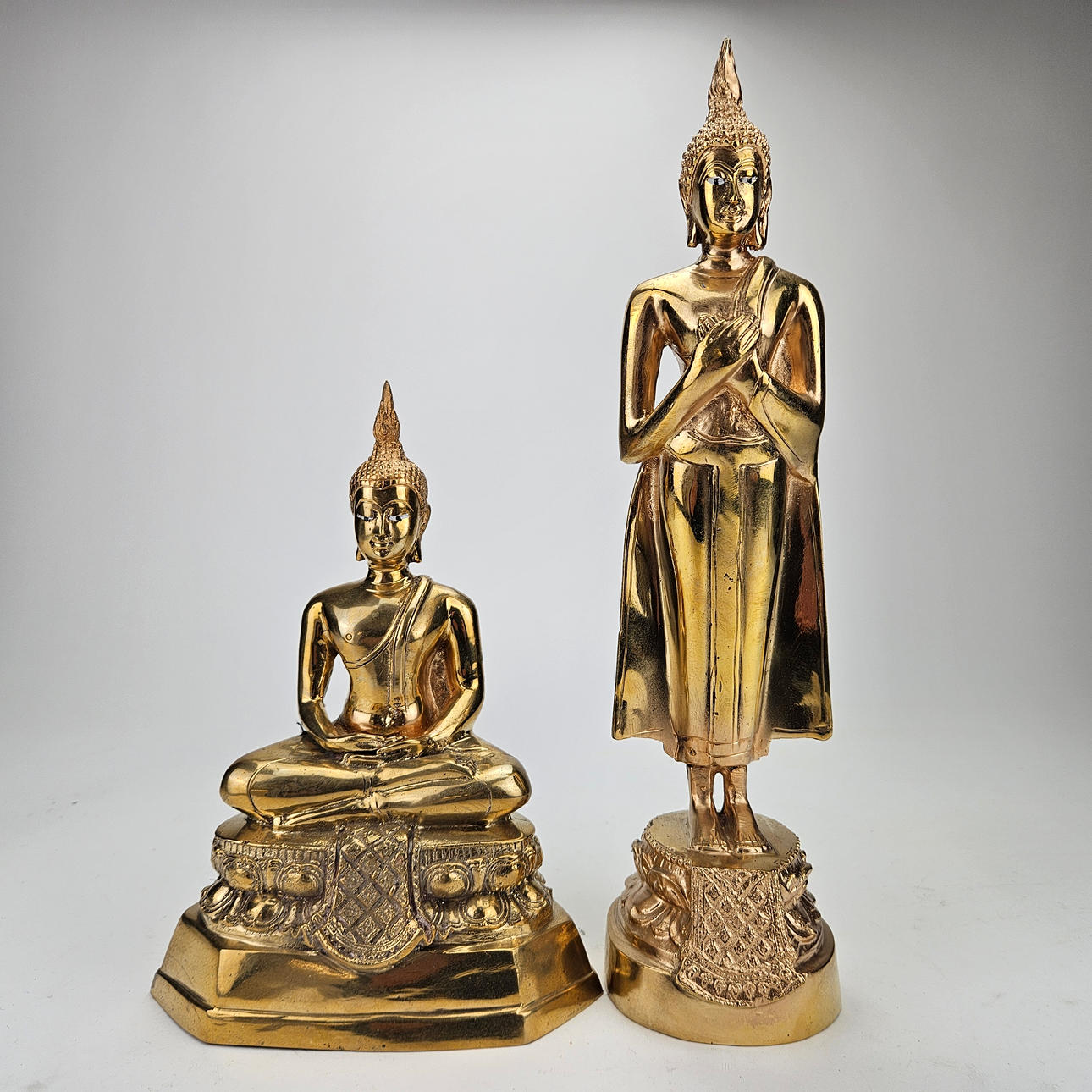 A 2-piece metal Buddha deity, oriental.